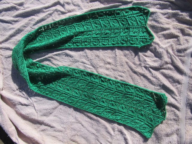 green knitted leafy lace pattern scarf